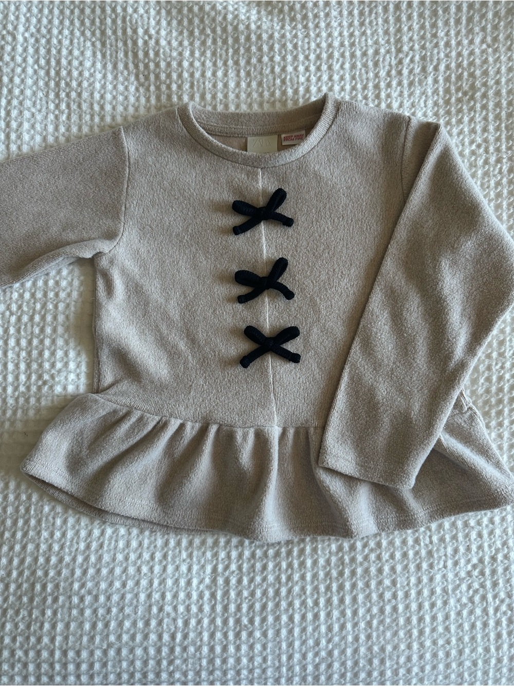 Zara Girls | Cream Peplum Sweater with Black Bow Accents